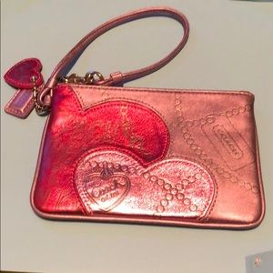 Coach metallic leather wristlet.